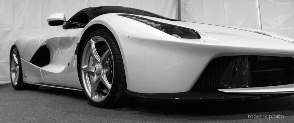 White Ferrari sports car photographed in profile